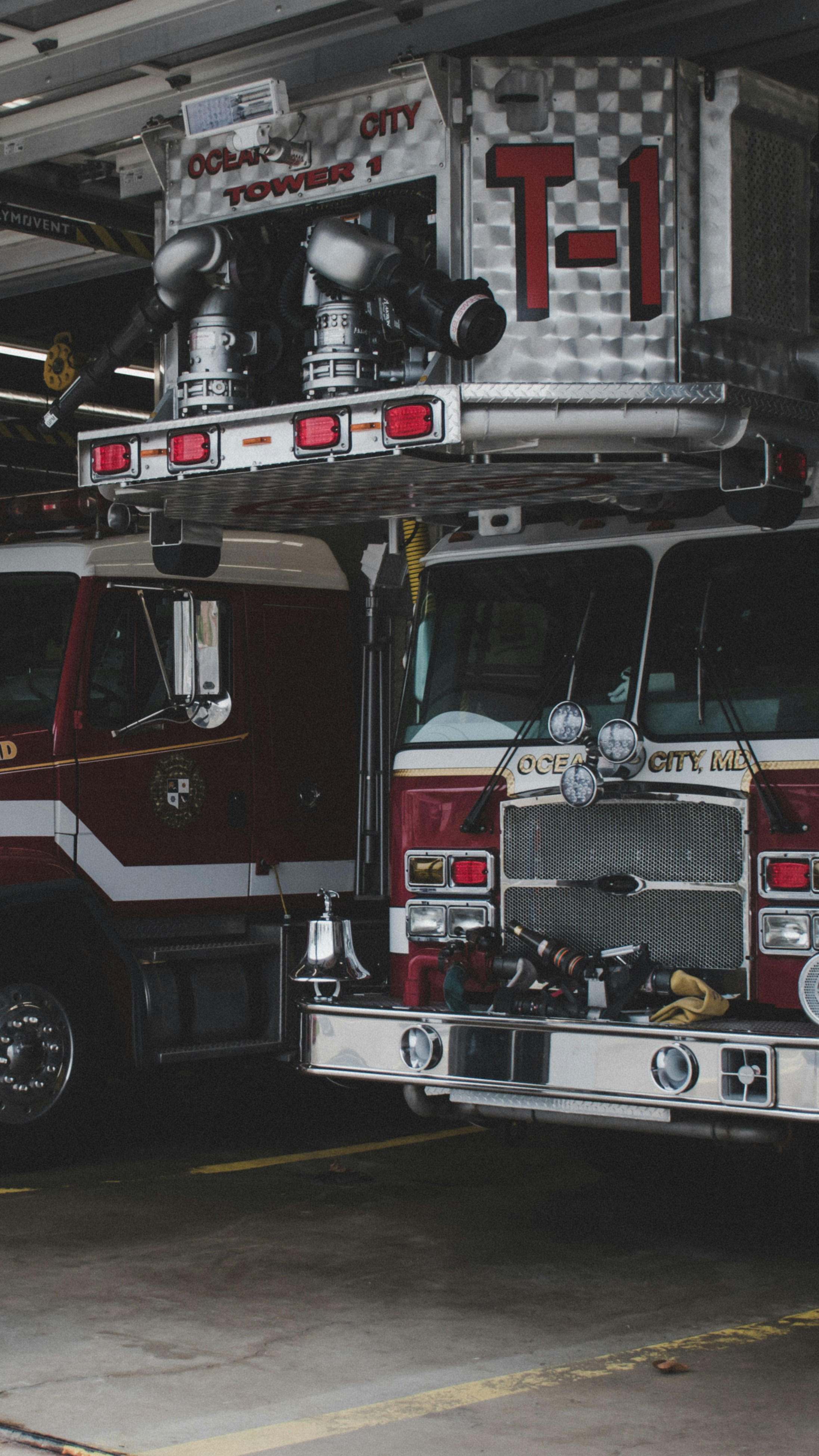 Fire department trucks in bay ready for deployment